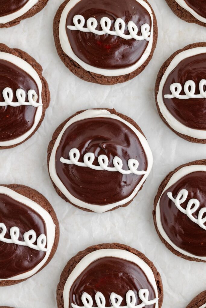 Chocolate Hostess cupcake cookies with marshmallow frosting, ganache and a white swirl.