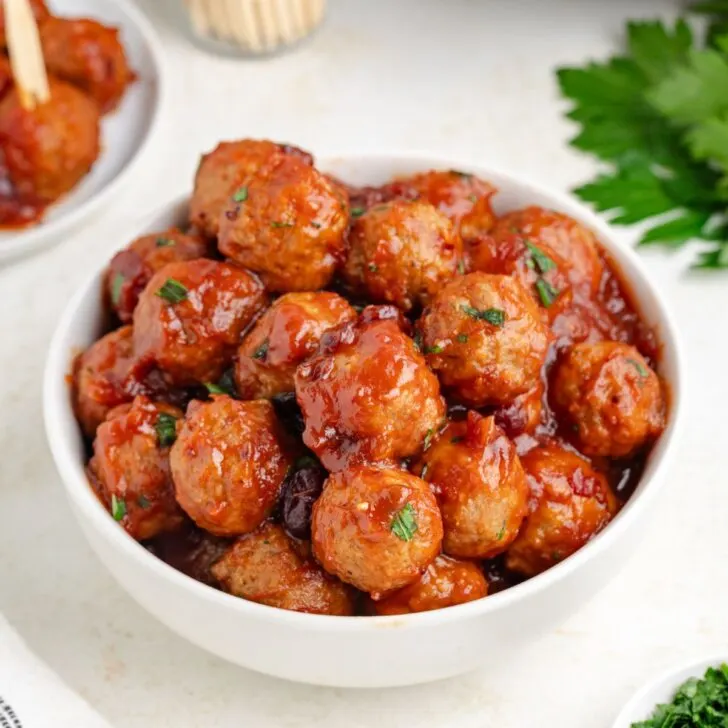 3-ingredient slow cooker cranberry meatballs in a white bowl.