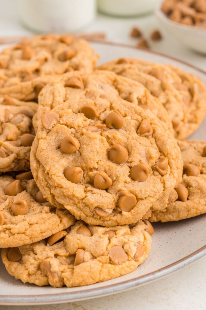 Plate of butterscotch pudding cookies with butterscotch chips.