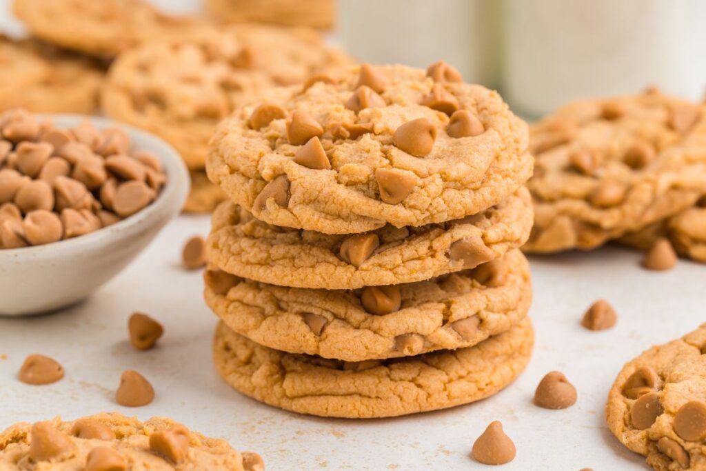 Stack of four cake mix butterscotch cookies with butterscotch chips.