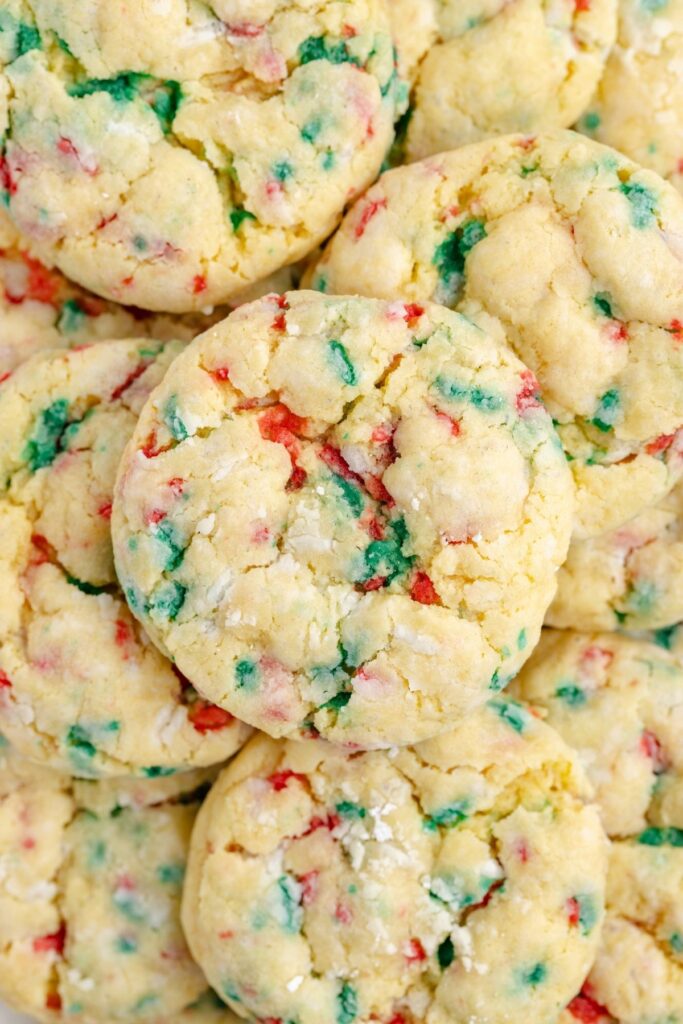 Pile of Christmas gooey butter cookies with red and green sprinkles.