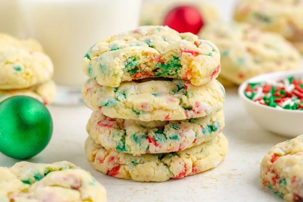 Stack for four gooey butter cookies with Christmas sprinkles.