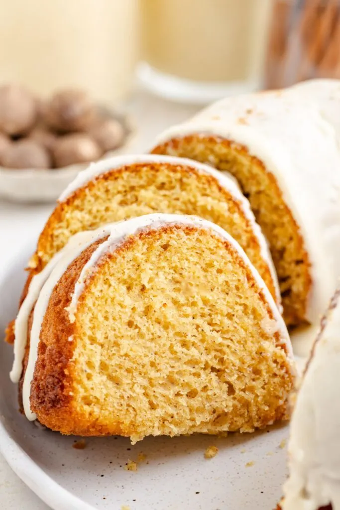 Slices of eggnog bundt cake on a platter.