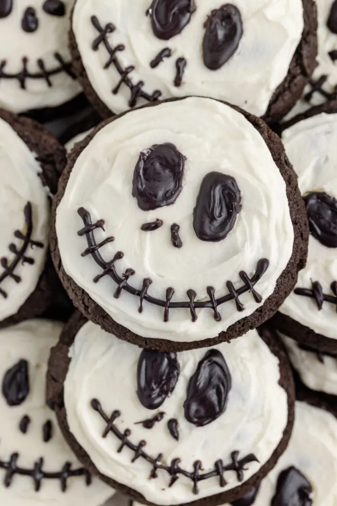 Pile of chocolate cake mix cookies decorated like Jack Skellington.