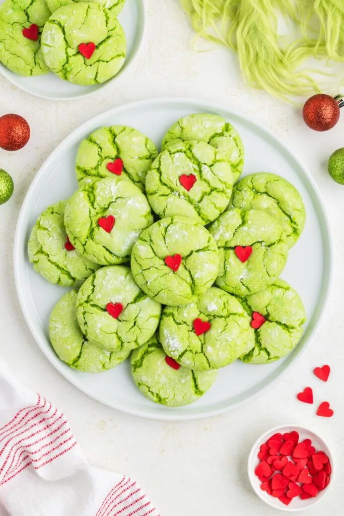 Plate full of Grinch crinkle cookies.