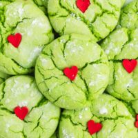 Pile of green cake mix Grinch Christmas cookies.