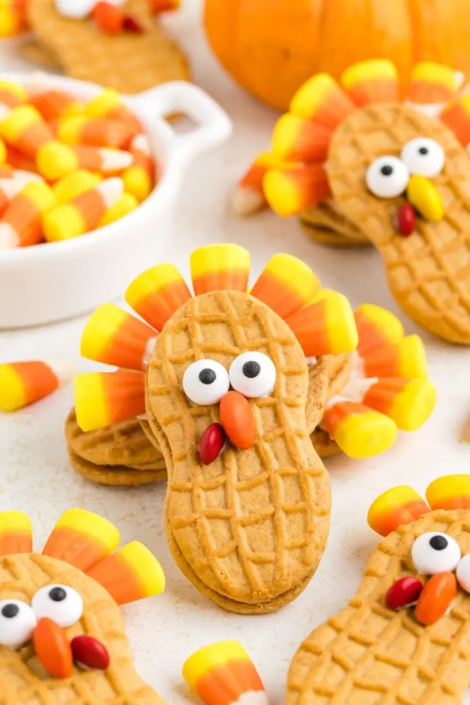 Cute turkey cookies made from Nutter Butters, candy corn, and M&Ms.