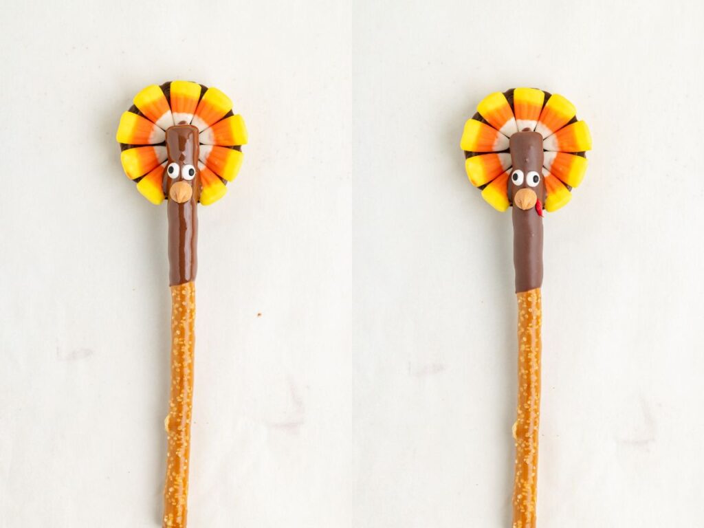 Two pretzel sticks each have a fun, edible turkey decoration on top. The turkeys are made with candy corn for feathers, chocolate for the body, and small candy eyes. They are placed side by side on a light background.