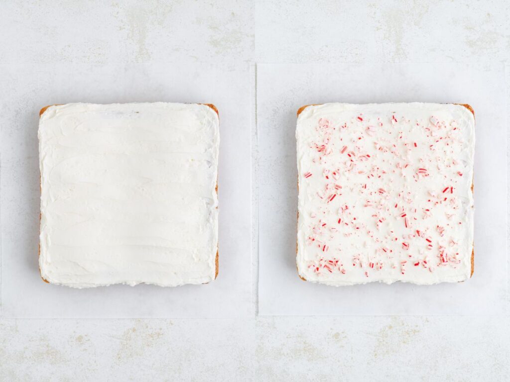 Two square cookies on a white surface. The left cake is covered with plain white frosting. The right cookie has white frosting with bits of crushed red peppermint candy sprinkled on top.