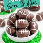 Oreo Football Truffles decorated with white icing, served in a bowl on green shredded coconut "grass.