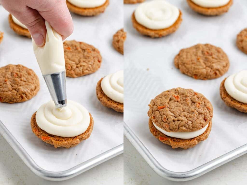 Piping cream onto carrot cake cookies on a sheet, then sandwiching with another cookie.