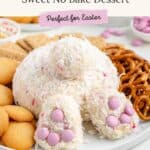Bunny-shaped coconut cheese ball with pink candy feet, pretzels, and cookies on a plate. Text: Cute Bunny Cheese Ball.