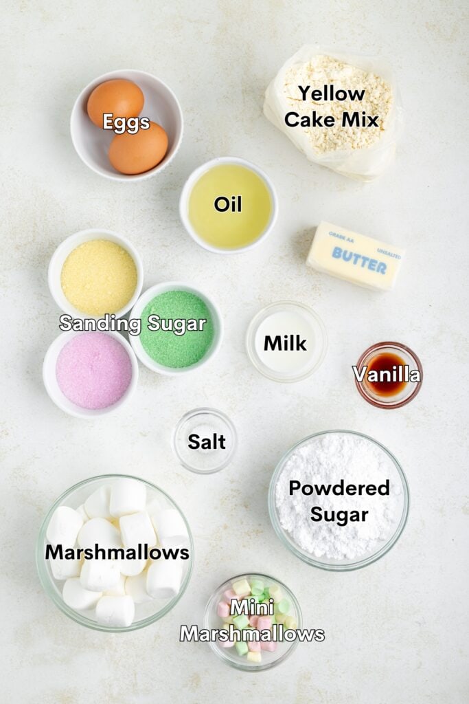 Ingredients including eggs, cake mix, butter, and marshmallows arranged on a kitchen countertop.