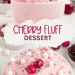 Bowl of cherry fluff dessert with cherries and mini marshmallows, extra servings and ingredients in background.