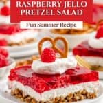 Raspberry Pretzel Salad slice with whipped cream, raspberry, and pretzel on a white plate; more slices behind.