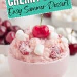 Pink bowl of Cherry Fluff topped with mini marshmallows and a cherry. Text: Cherry Fluff Easy Summer Dessert.