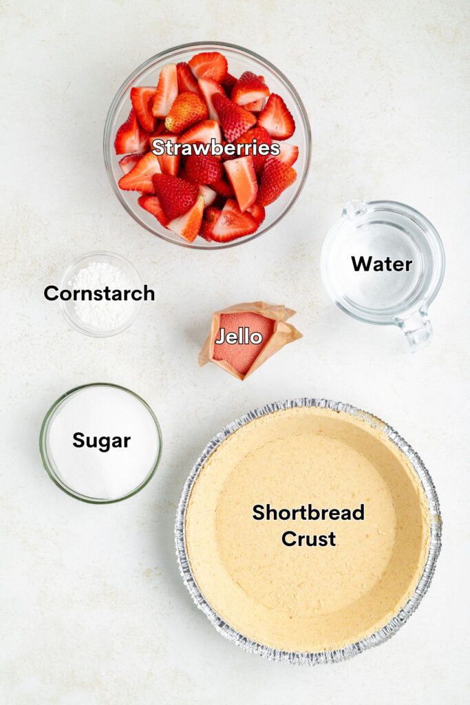 Labeled ingredients for strawberry pie, including strawberries, cornstarch, sugar, Jello powder, water, and shortbread crust.