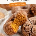 Close-up of cinnamon-sugar baked pumpkin donuts, one broken to show moist interior. Text: easy cake mix recipe.