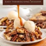 Pecan pie dump cake slice with vanilla ice cream and caramel sauce, garnished with whole pecans on the side.