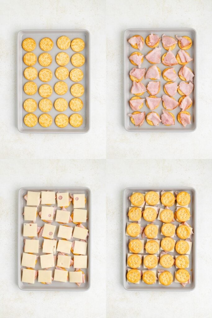 Crackers on a tray layered with ham and cheese, then topped with more crackers to form sandwiches.