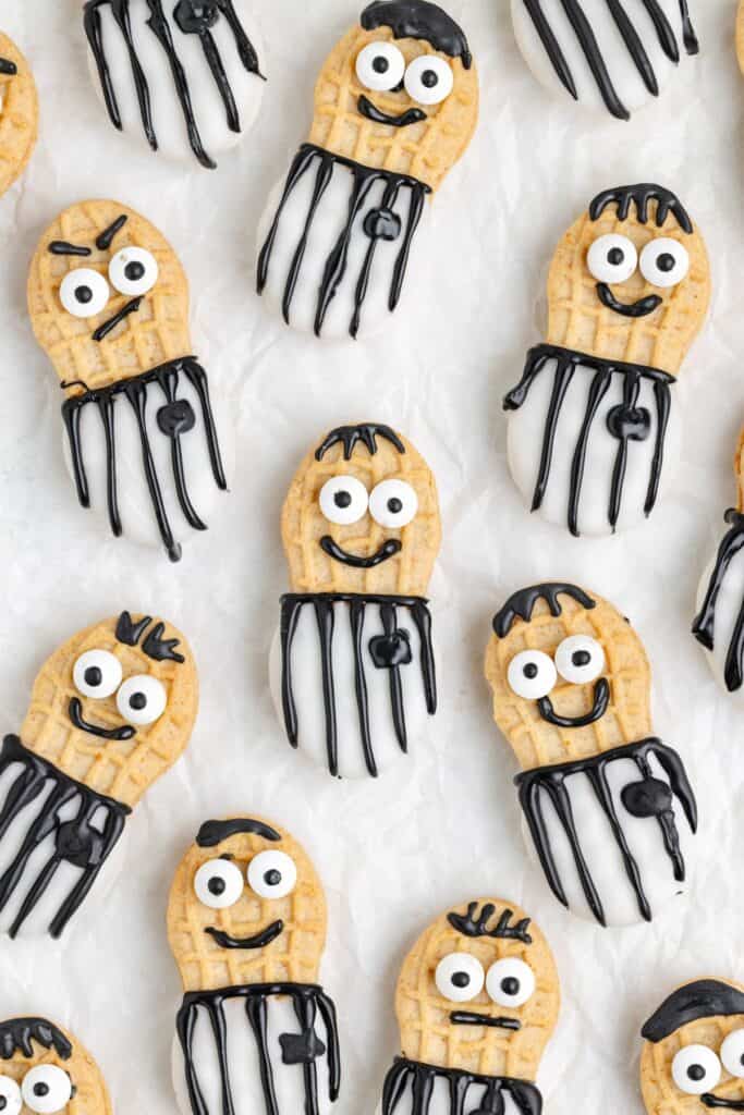 Referee Nutter Butter cookies with candy eyes and assorted facial expressions.