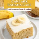 A slice of banana cake with cream cheese frosting and banana slices on a white plate, other cake in background.