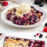 Berry dump cake topped with vanilla ice cream on a plate, above a baking dish, with fresh berries nearby.