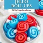 Plate of red and blue Jello Roll Ups with marshmallows on white; text reads Easy Jello Roll Ups With Marshmallows.