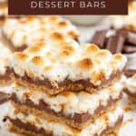 Three smores dessert bars stacked with toasted marshmallows, chocolate, and graham cracker; text says Smores Dessert Bars.