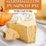 Slice of marshmallow pumpkin pie with Cool Whip and whipped cream on a white plate, fork holding a bite.