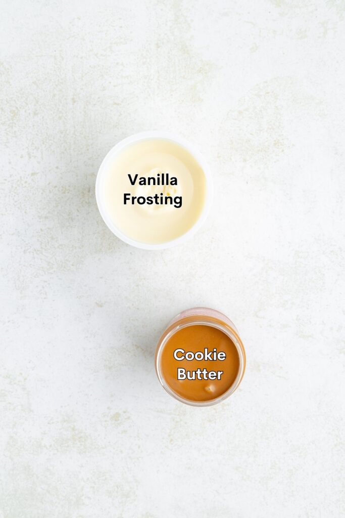 An open container of vanilla frosting and an open jar of cookie butter.