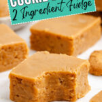 Squares of 2-ingredient Biscoff fudge on parchment paper with Cookie Butter 2 Ingredient Fudge text overlay.