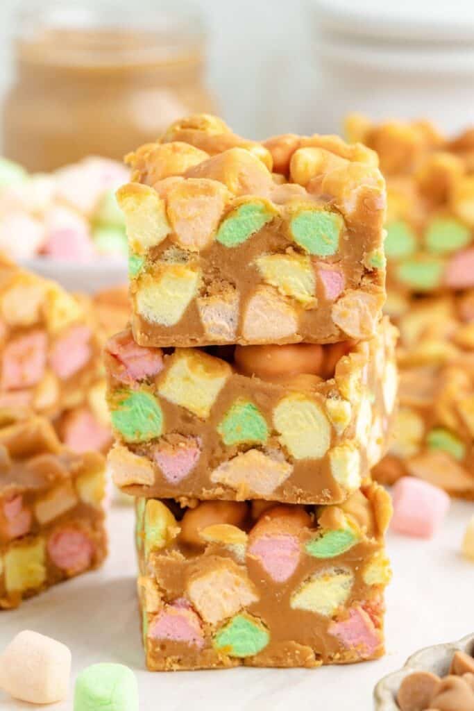 A stack of three square peanut butter marshmallow bars.
